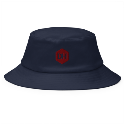 Close-up of a navy bucket hat with a red stitched hex logo showing the letters 'DH'.