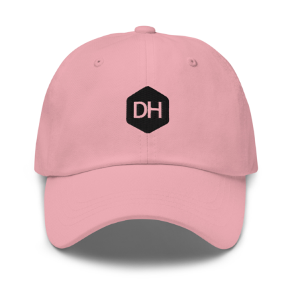 Close-up of a pink baseball cap with a black DH hexagon logo on the front panel and crown stitching visible in the background.