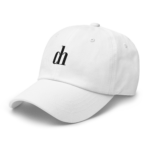 Close-up of a white baseball cap with stitched panels, viewed at an angle against a black background.