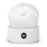 White knit beanie with a black octagonal logo containing the letters DH on the front.