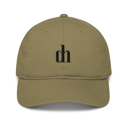 Khaki baseball cap close-up showing top button, stitched panels, and a partial black embroidery on the front.