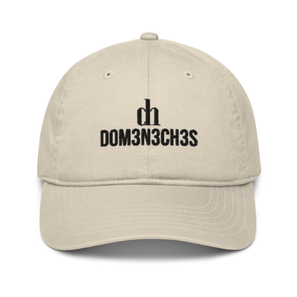 Beige baseball cap shown from the front with bold black embroidery reading dm3n3ch3s on the front panel.