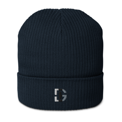 Close-up of a dark navy knitted beanie with a ribbed texture and a partial white logo at the cuff against a white background.
