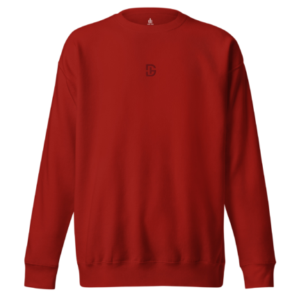 Red crewneck sweatshirt with a small dark emblem centered on the chest.